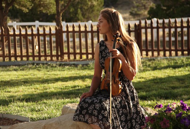 Haley Jameson playing violin at a wedding at  Pennington Place in Walsenburg